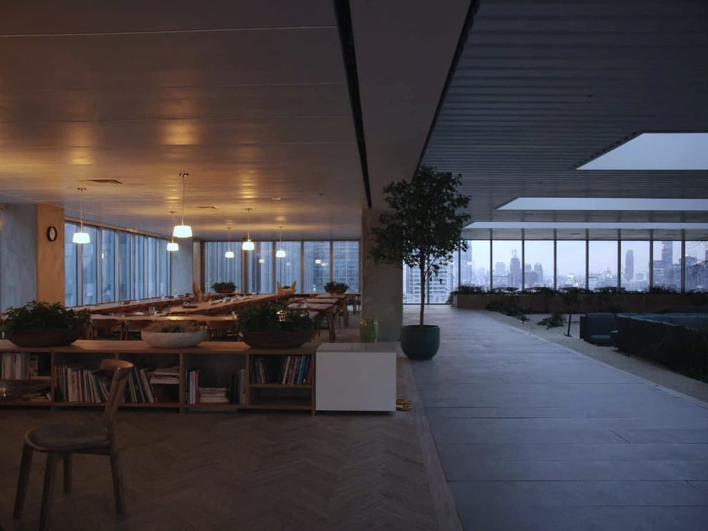 Interior rendering of The Monroe Room, a full-floor amenity level with dining and meeting commons at dusk.